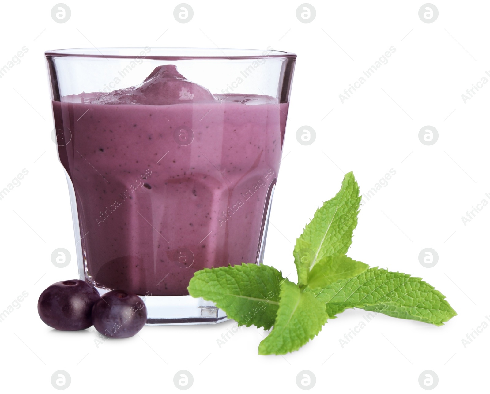 Photo of Tasty acai smoothie in glass, mint and berries isolated on white