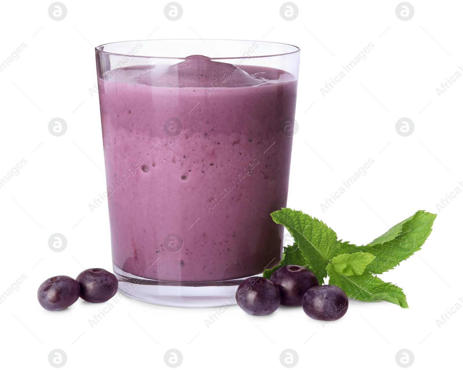 Photo of Tasty acai smoothie in glass, mint and berries isolated on white