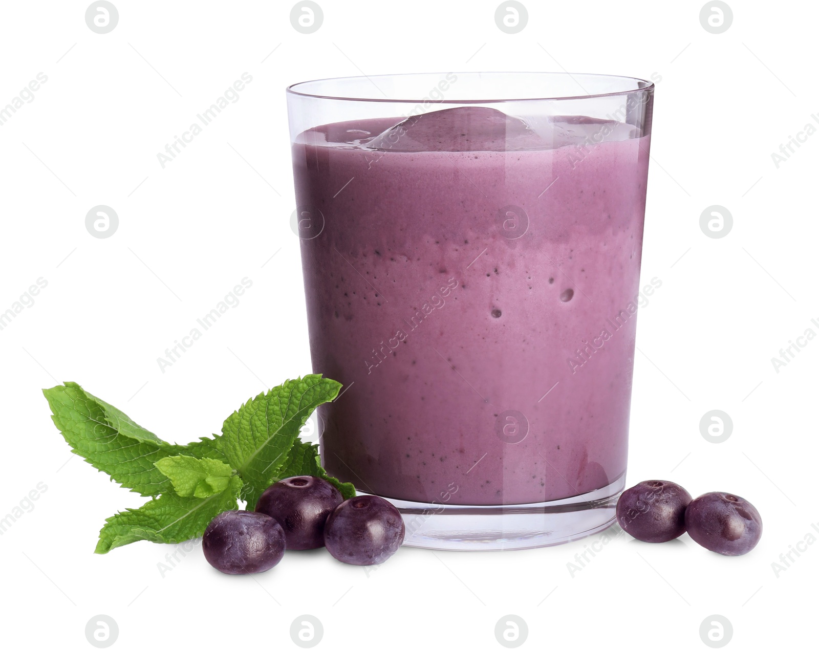 Photo of Tasty acai smoothie in glass, mint and berries isolated on white