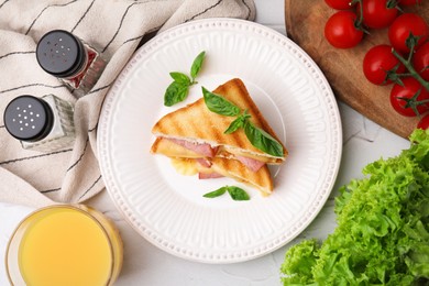 Photo of Pieces of toasted bread with melted cheese served on white table, top view