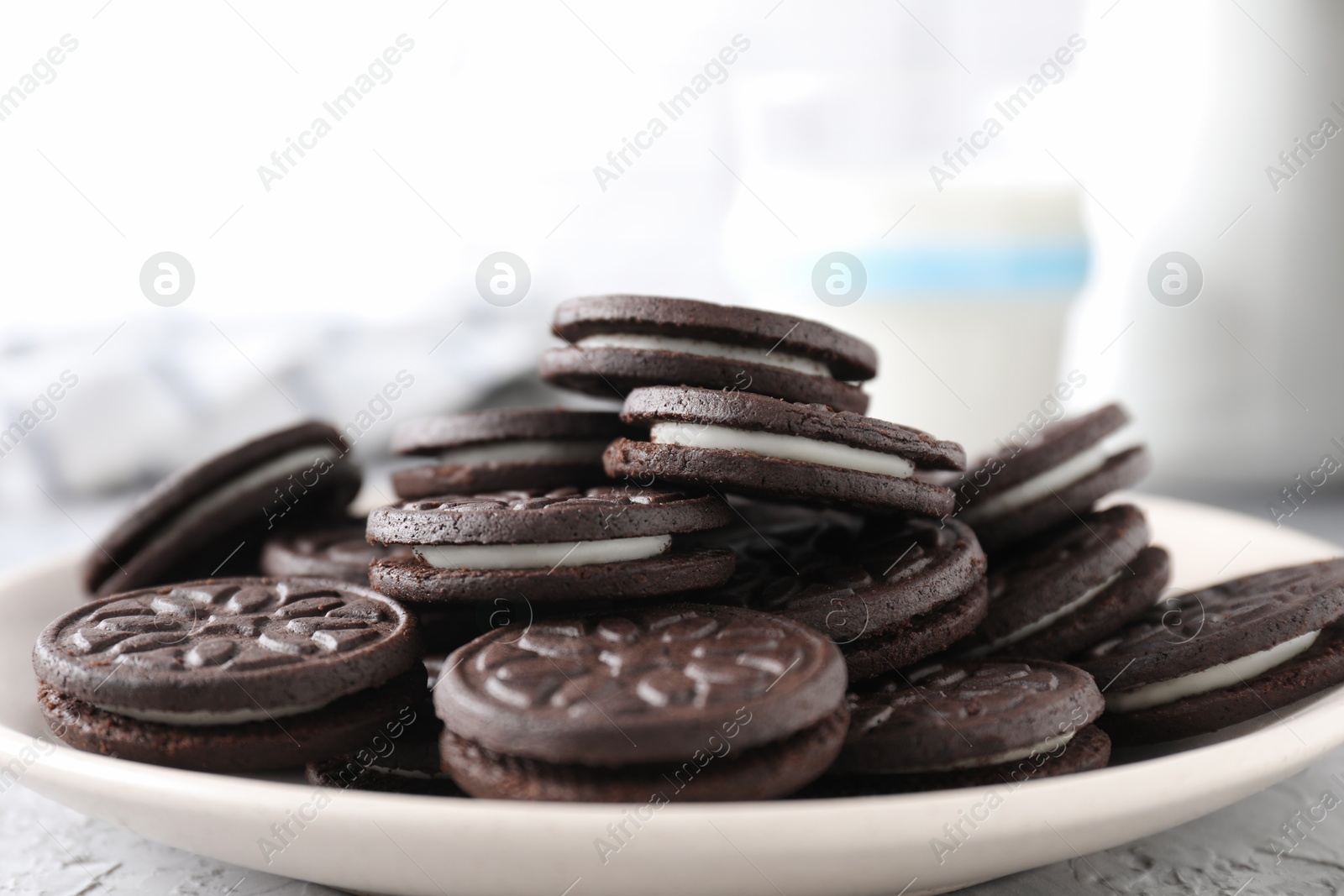 Photo of Many tasty sandwich cookies on table, closeup