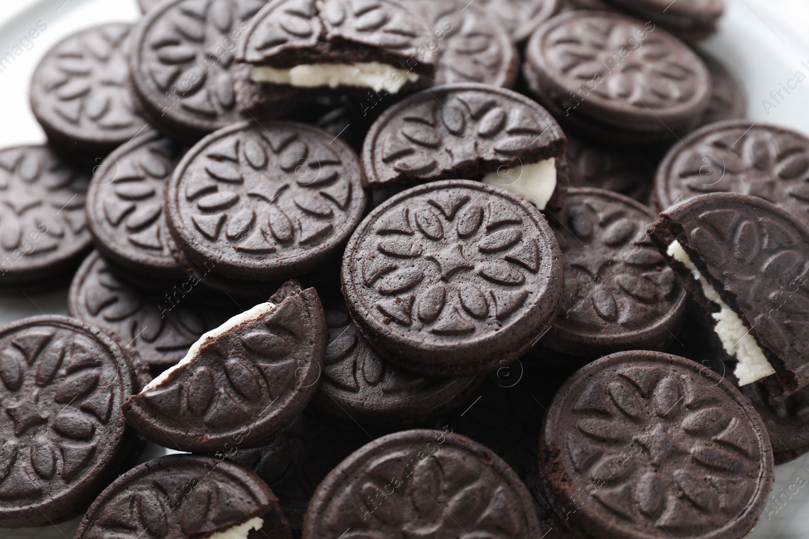 Photo of Tasty sandwich cookies on table, closeup view