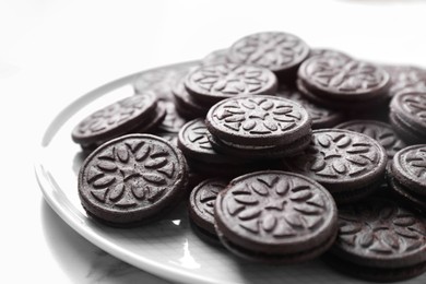 Photo of Tasty sandwich cookies on white marble table, closeup