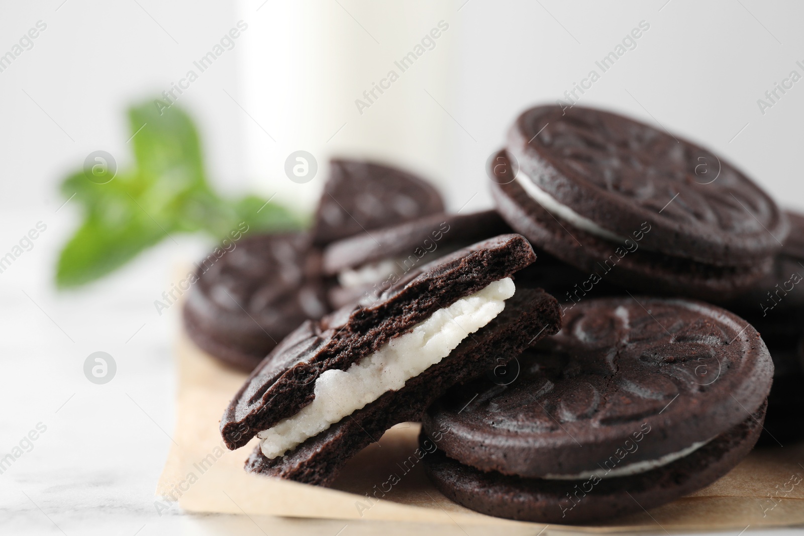 Photo of Many tasty sandwich cookies on table, closeup