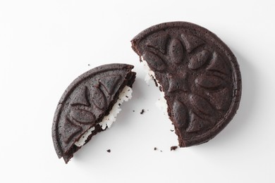 Photo of Broken tasty sandwich cookie on white background, top view