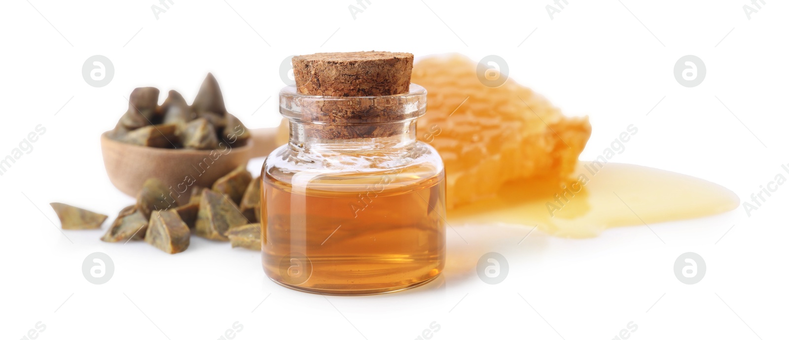 Photo of Natural honey tincture, propolis granules and sweet honeycomb isolated on white