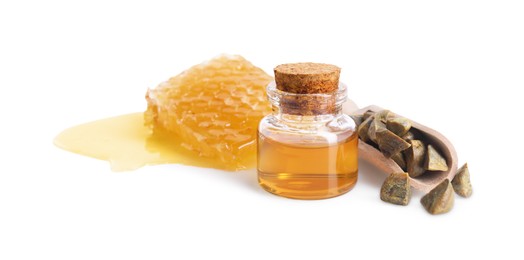 Photo of Natural honey tincture, propolis granules and sweet honeycomb isolated on white