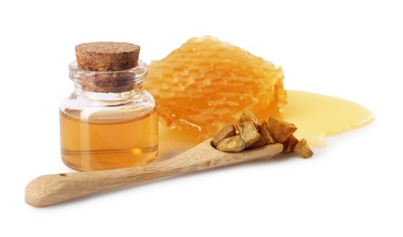 Photo of Natural honey tincture, propolis granules and sweet honeycomb isolated on white