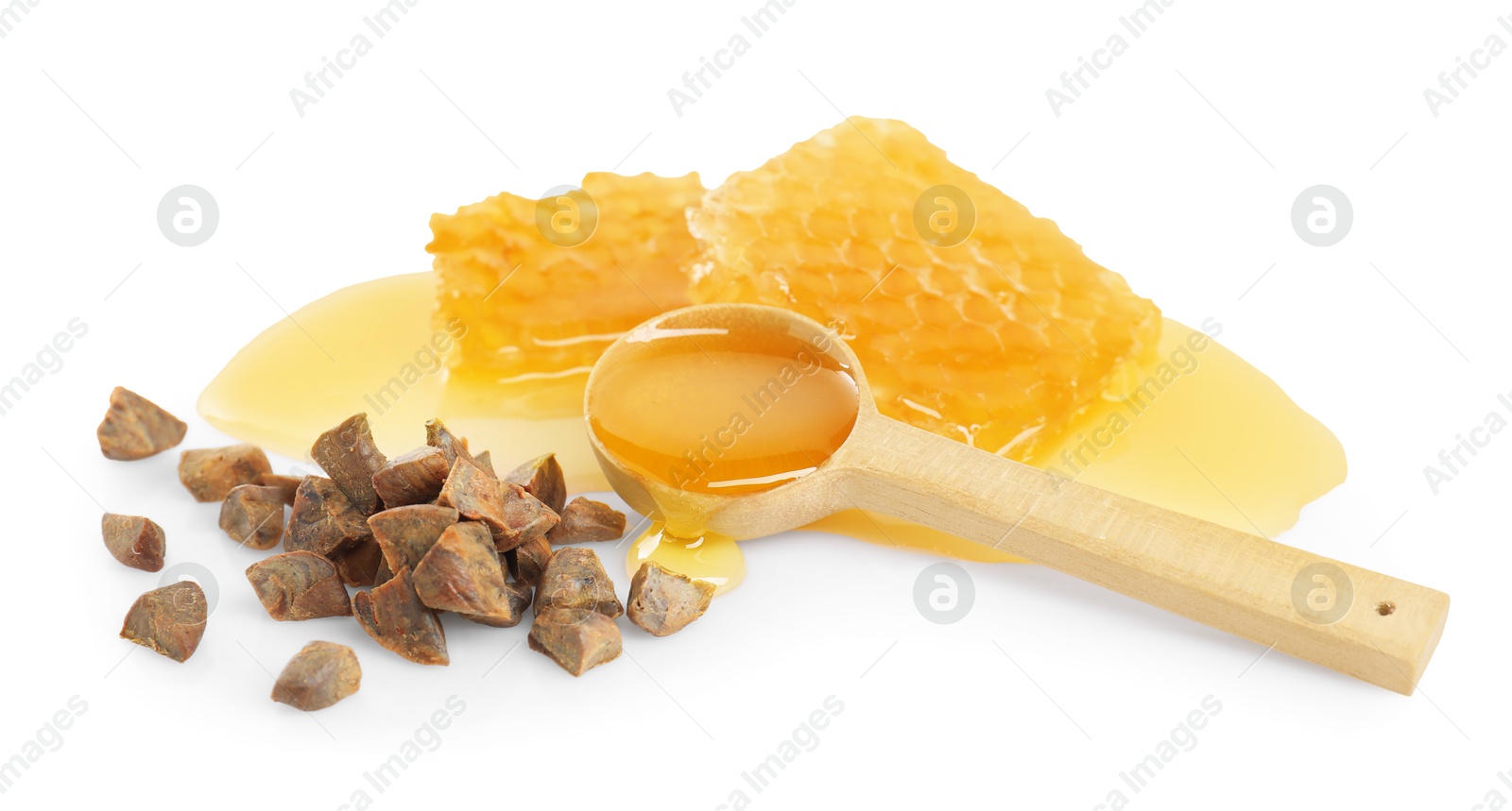 Photo of Sweet honeycombs and propolis granules isolated on white