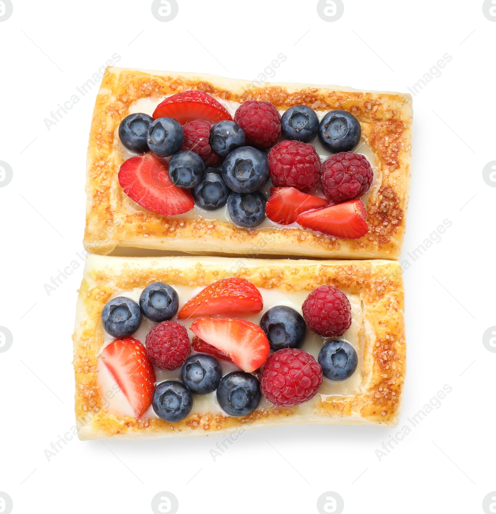 Photo of Tasty puff pastries with berries isolated on white, top view