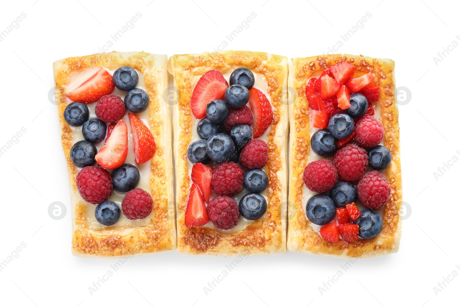 Photo of Tasty puff pastries with berries isolated on white, top view