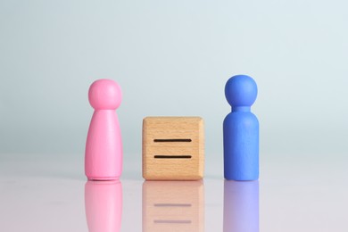 Photo of Gender equality concept. Male and female figures on light background