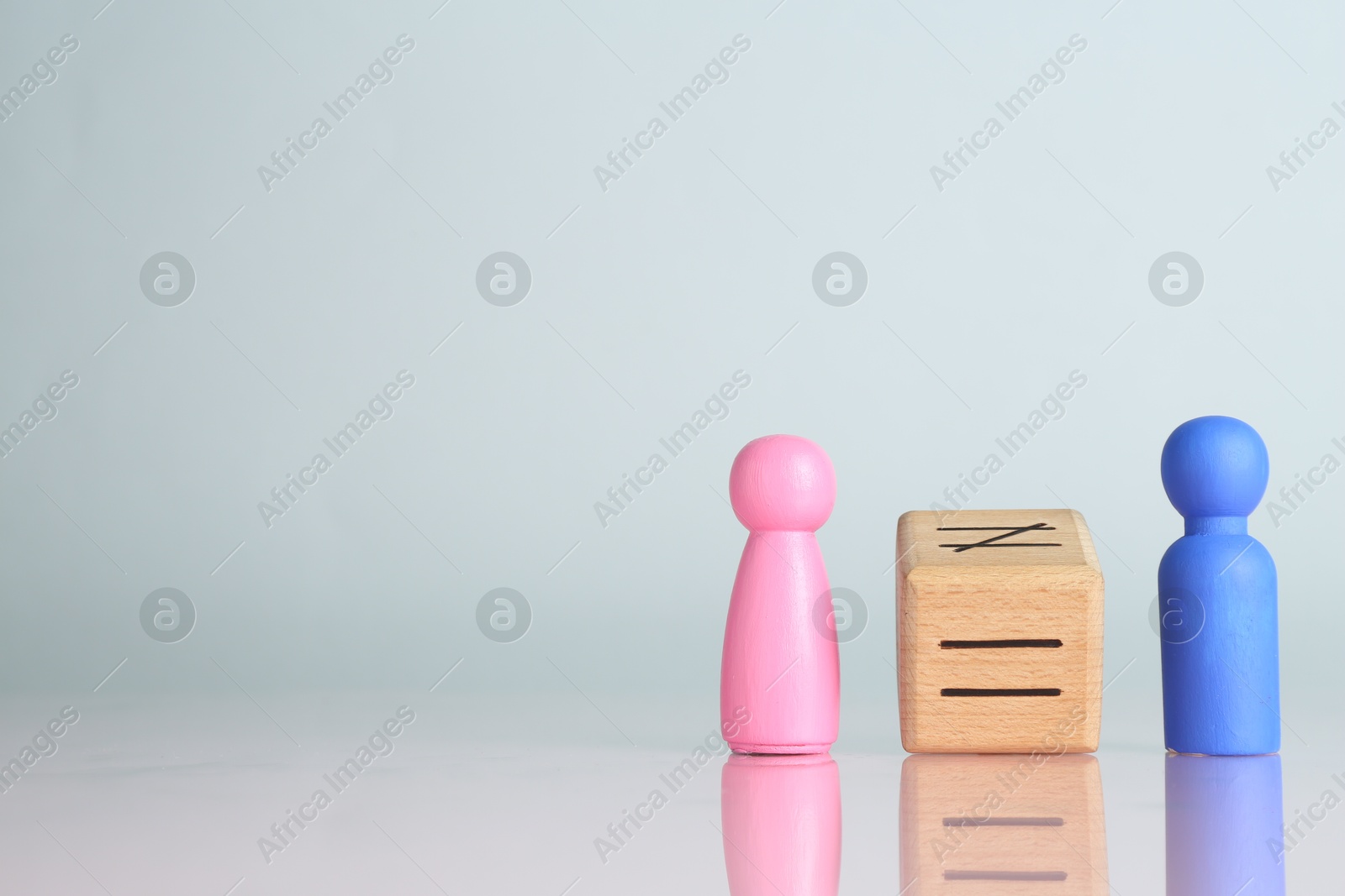 Photo of Gender equality concept. Male and female figures on light background, space for text