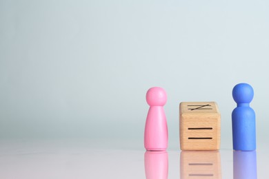 Photo of Gender equality concept. Male and female figures on light background, space for text