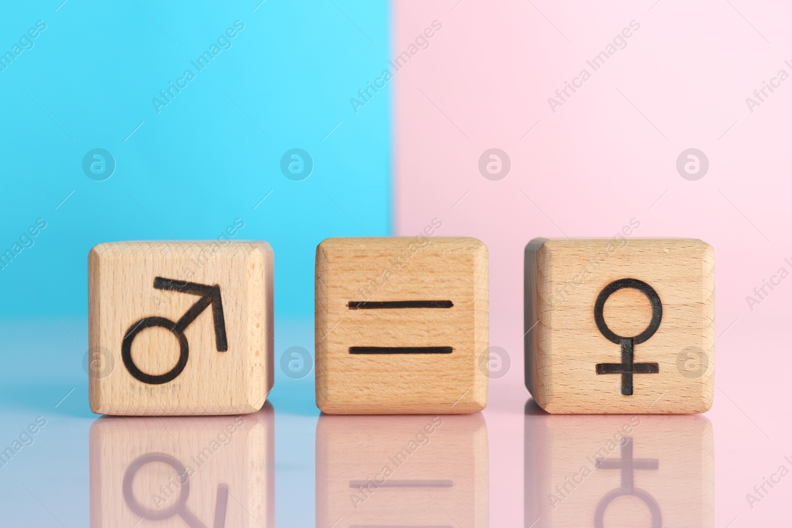 Photo of Gender equality concept. Cubes with male and female symbols on color background