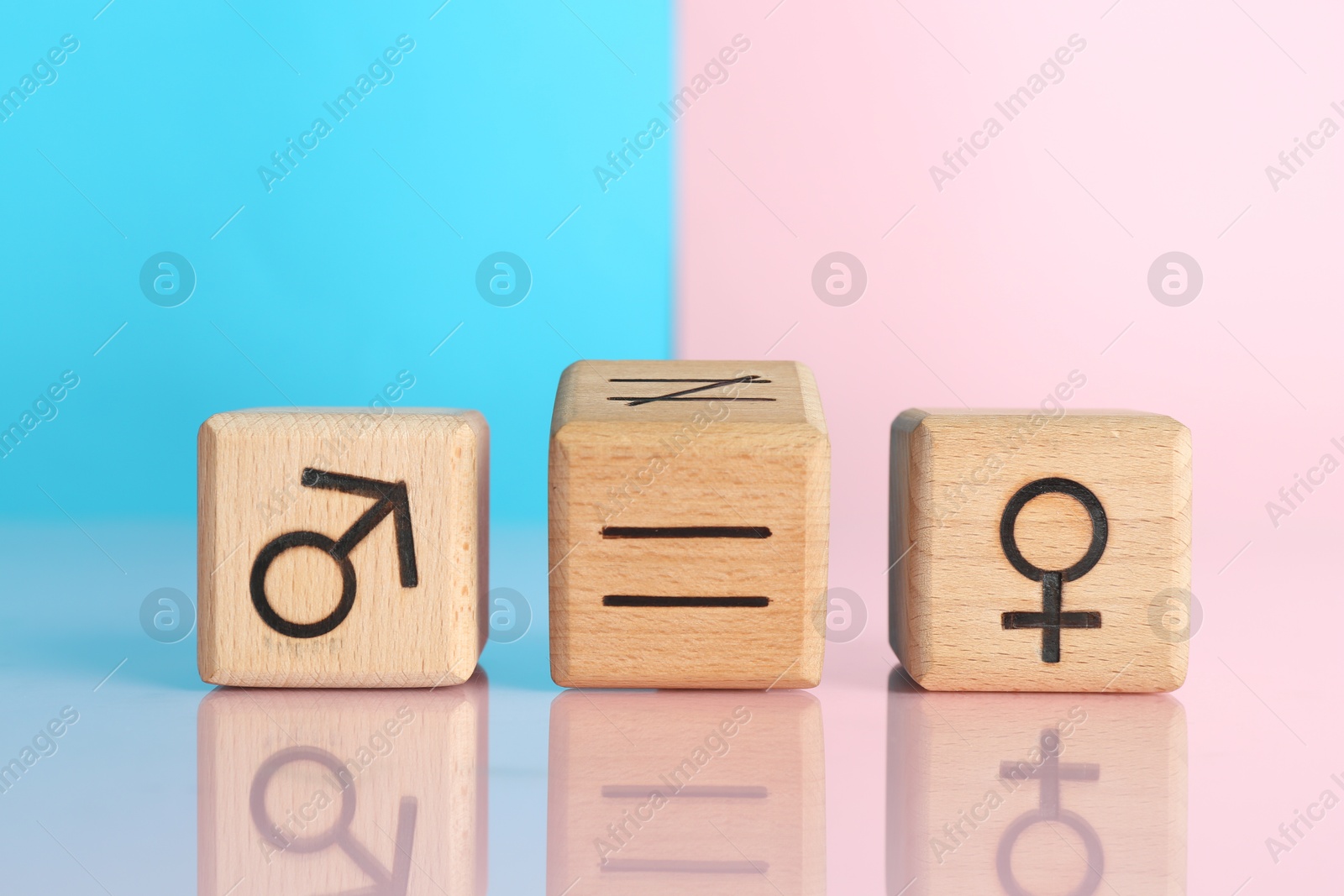 Photo of Gender equality concept. Cubes with male and female symbols on color background