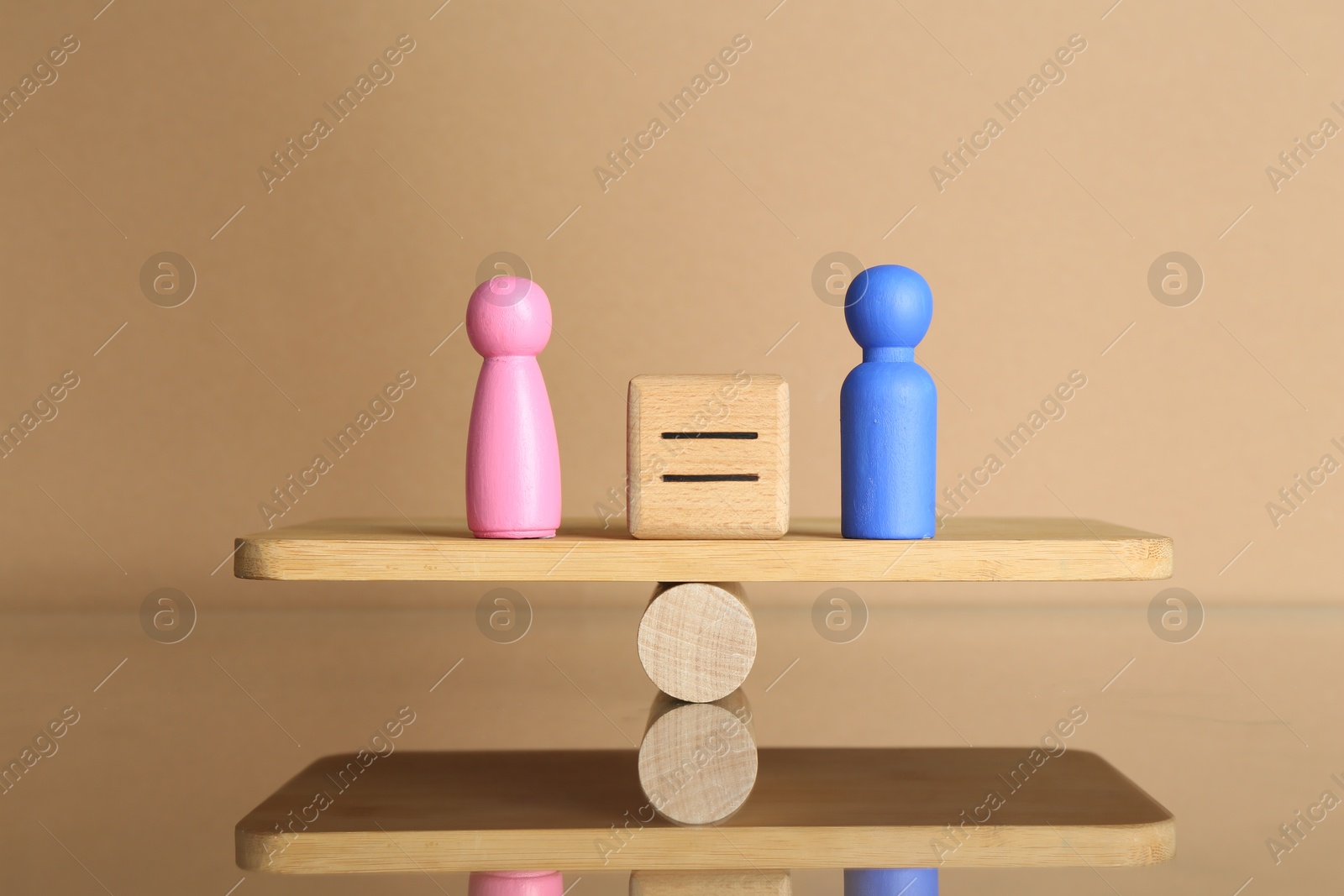 Photo of Gender equality concept. Cube with equals sign between male and female figures on scales against beige background