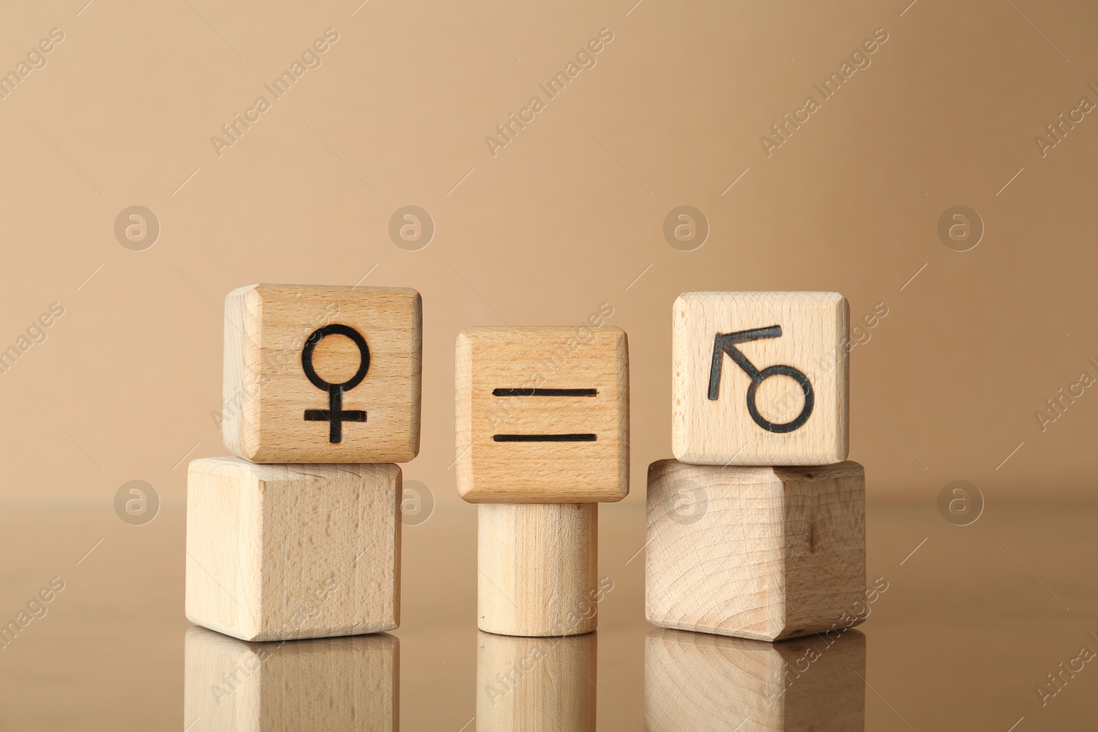 Photo of Gender equality concept. Cubes with male and female symbols on beige background