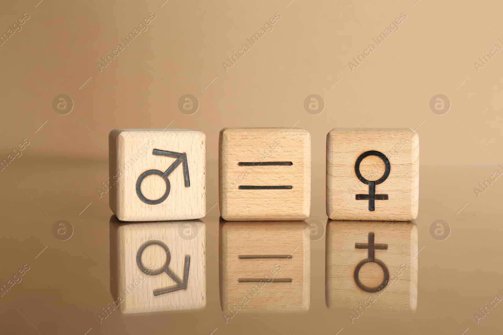 Photo of Gender equality concept. Cubes with male and female symbols on beige background