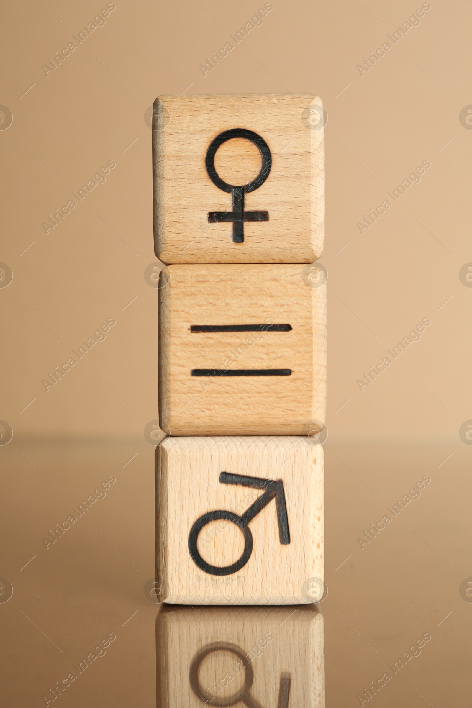 Photo of Gender equality concept. Cubes with male and female symbols on beige background