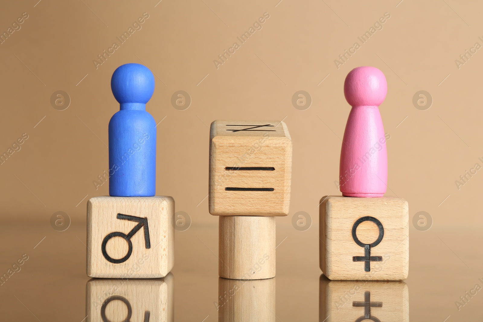 Photo of Gender equality concept. Male and female figures on beige background