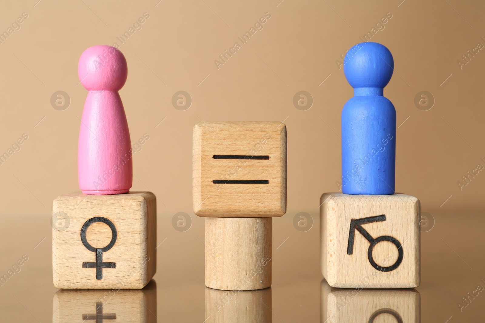 Photo of Gender equality concept. Male and female figures on beige background