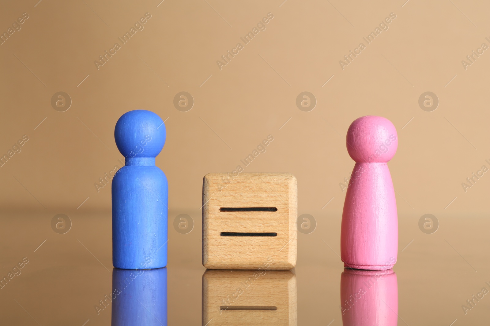 Photo of Gender equality concept. Male and female figures on beige background