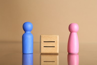 Photo of Gender equality concept. Male and female figures on beige background