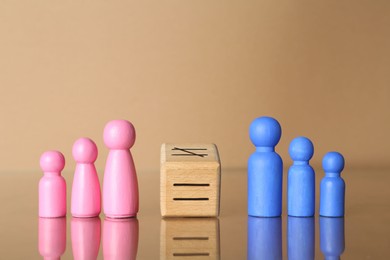 Gender equality concept. Male and female figures on beige background