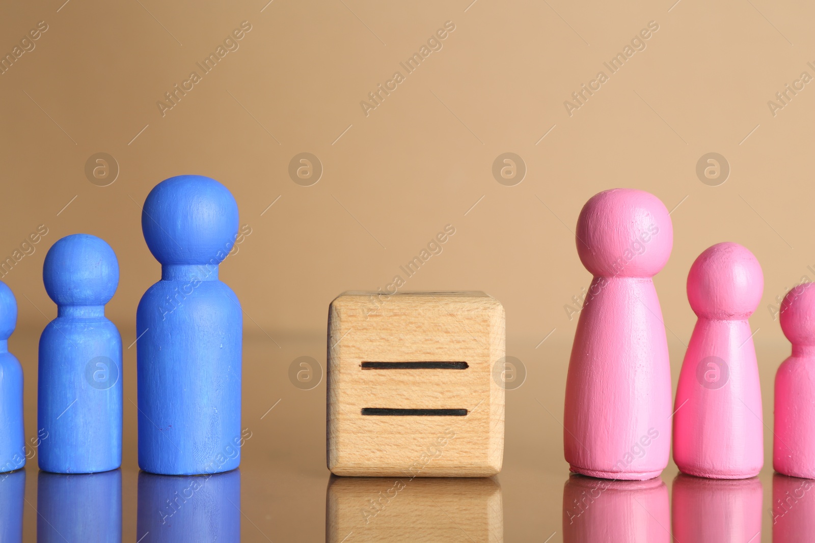 Photo of Gender equality concept. Male and female figures on beige background