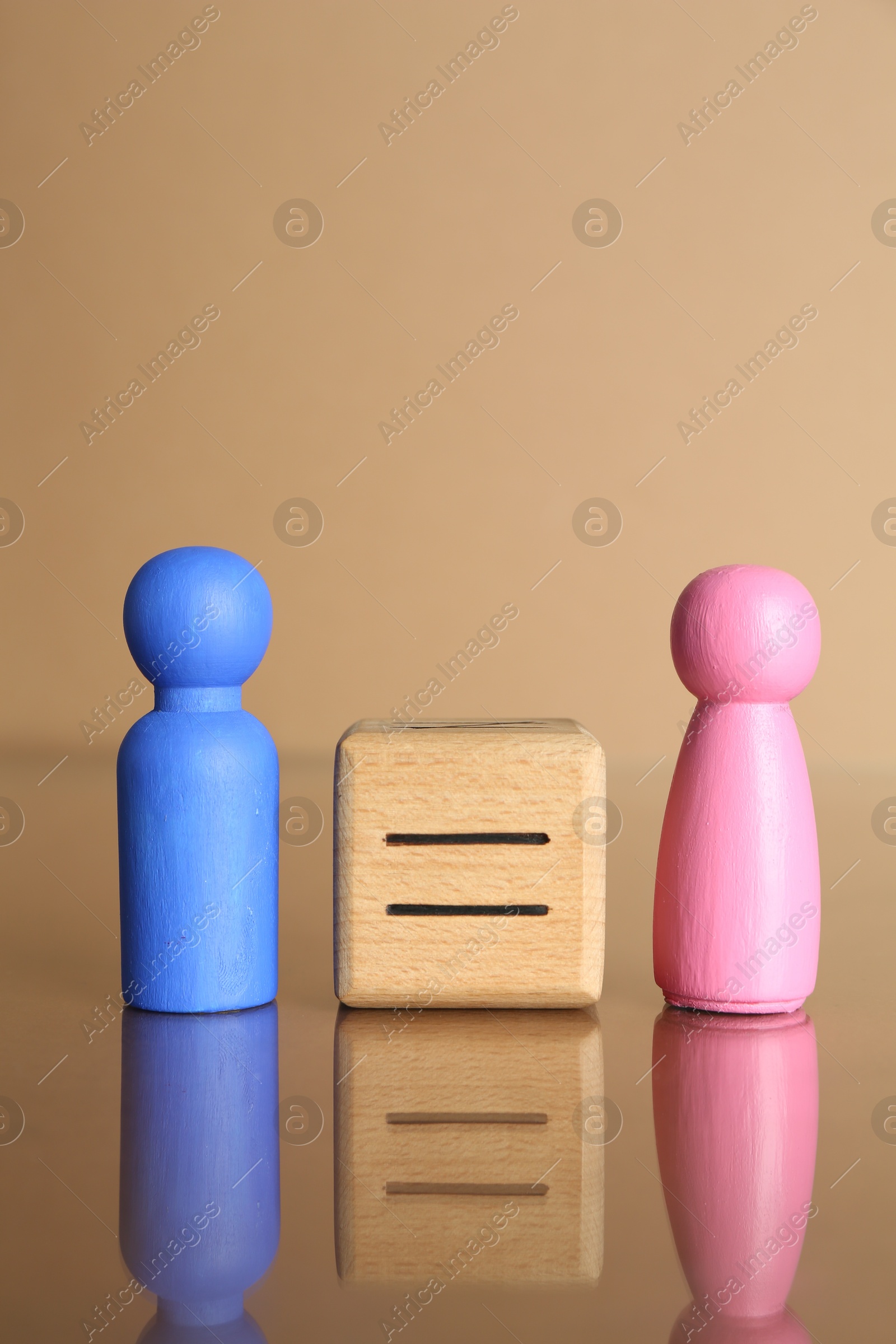 Photo of Gender equality concept. Male and female figures on beige background