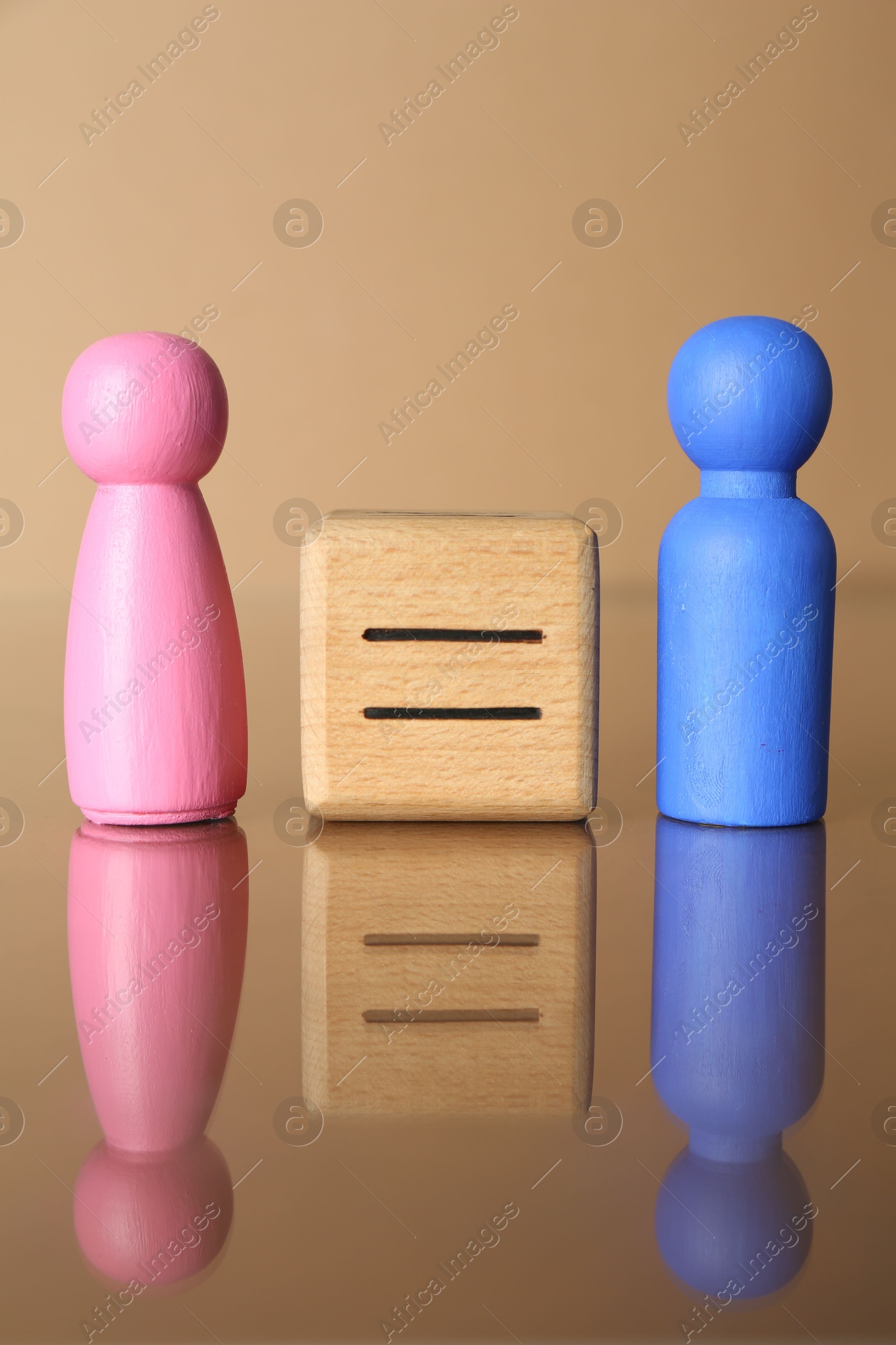 Photo of Gender equality concept. Male and female figures on beige background