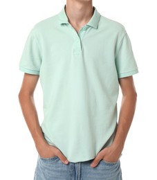 Teenage boy wearing light green t-shirt on white background, closeup