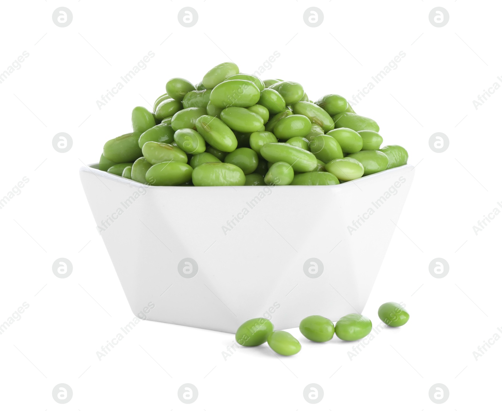 Photo of Raw green edamame soybeans in bowl isolated on white