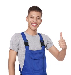 Photo of Smiling auto mechanic showing thumb up on white background