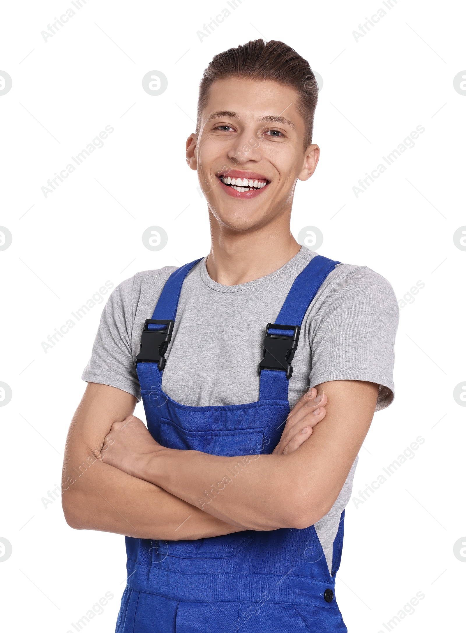 Photo of Smiling auto mechanic with crossed arms on white background