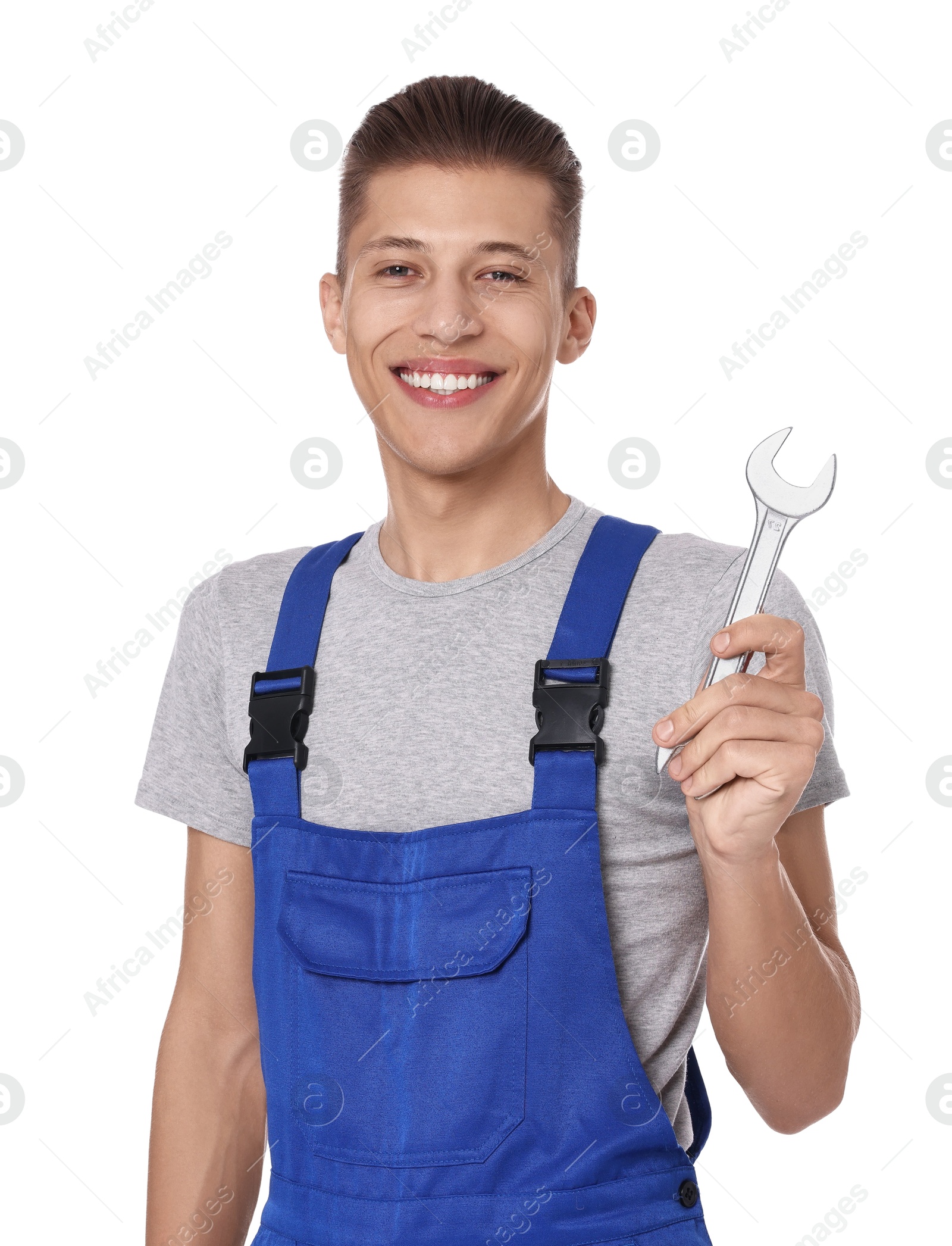 Photo of Smiling auto mechanic with wrench on white background