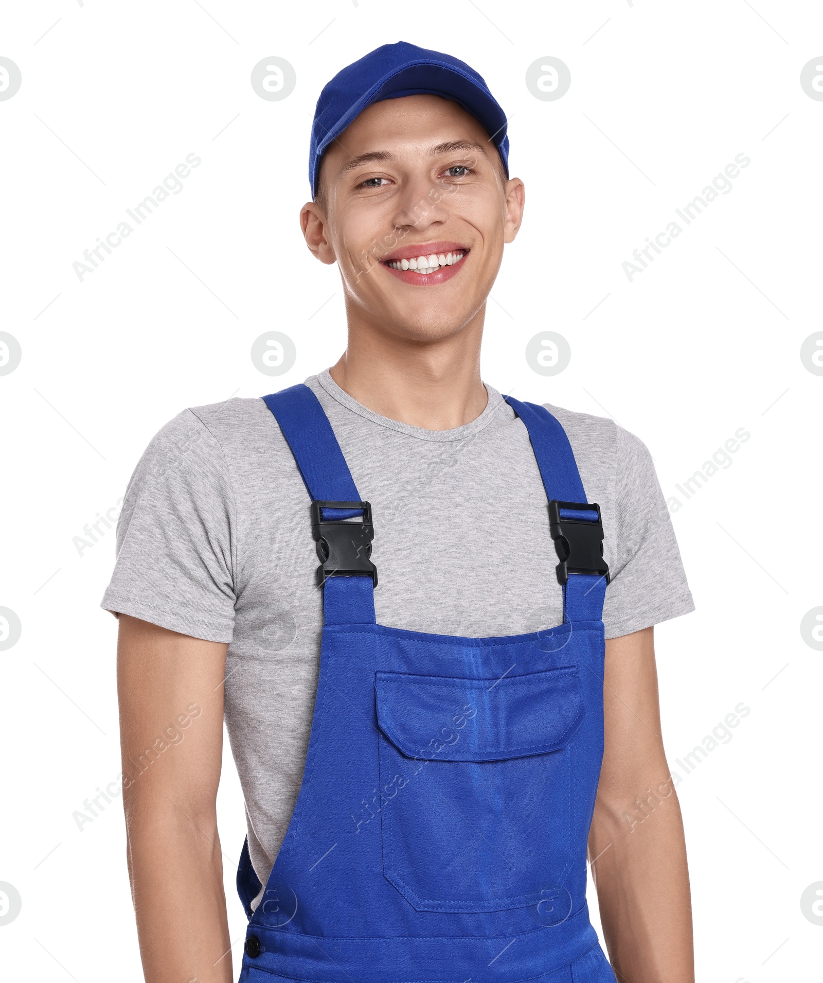 Photo of Smiling auto mechanic in uniform on white background