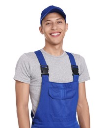 Smiling auto mechanic in uniform on white background