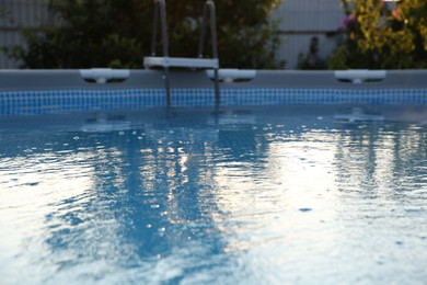 Above ground swimming pool in garden, closeup