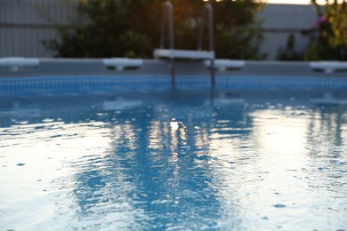 Photo of Above ground swimming pool in garden, closeup