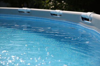 Photo of Above ground swimming pool outdoors on sunny day, closeup