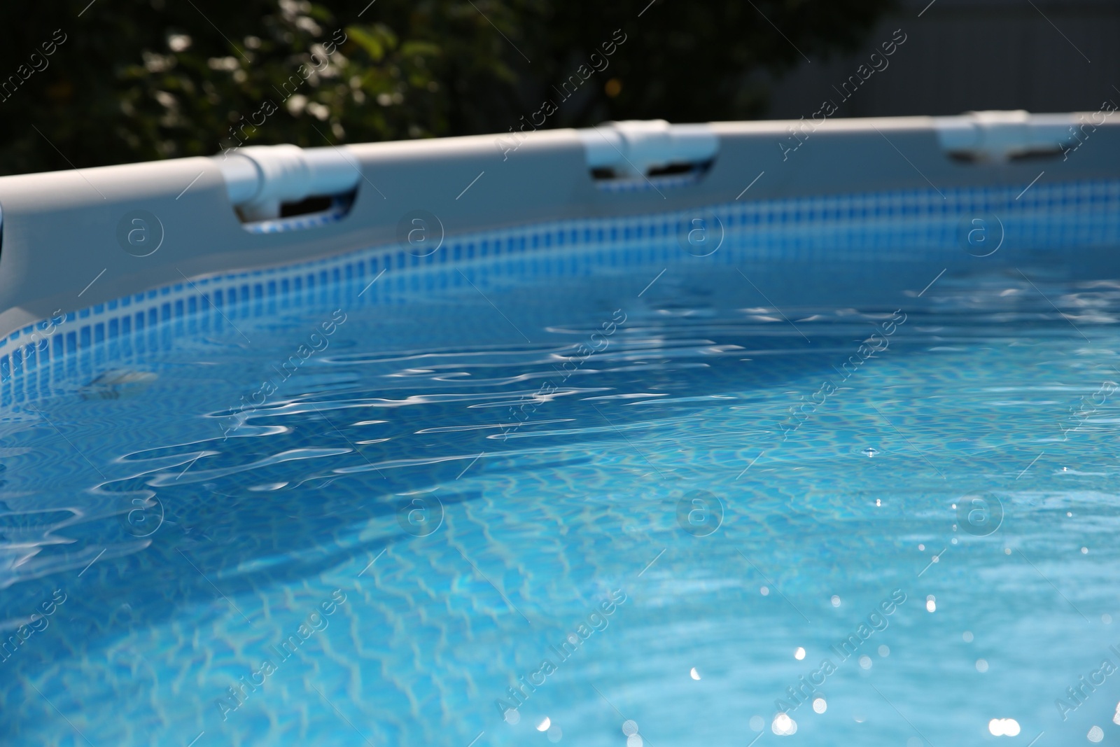 Photo of Above ground swimming pool outdoors on sunny day, closeup