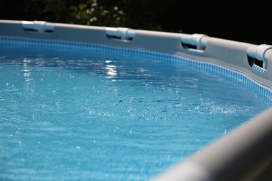 Above ground swimming pool outdoors on sunny day, closeup