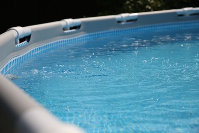 Above ground swimming pool outdoors on sunny day, closeup