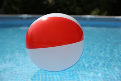 Inflatable ball in above ground swimming pool outdoors on sunny day