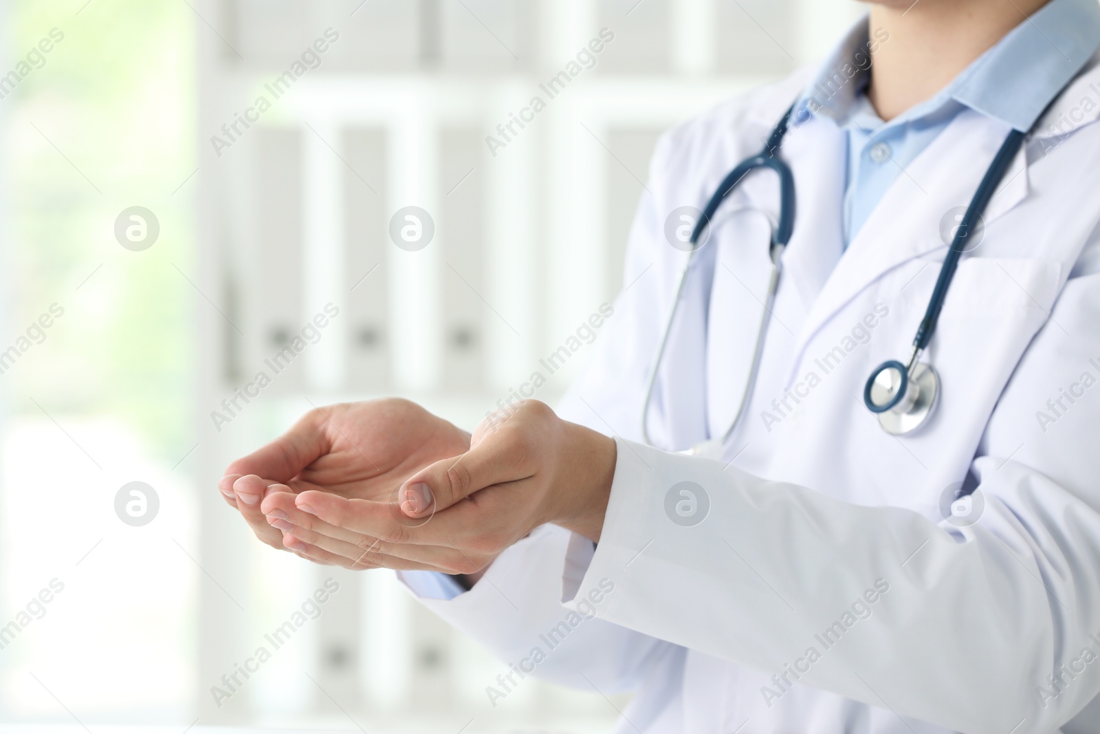 Photo of Doctor holding something in clinic, closeup view