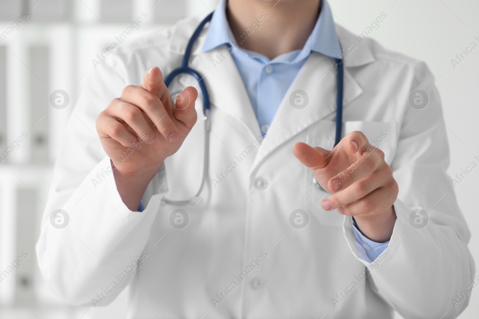 Photo of Doctor pointing at something in clinic, closeup