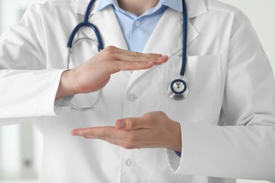 Doctor holding something in clinic, closeup view