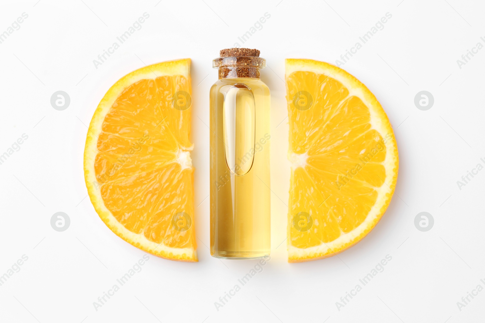 Photo of Bottle of essential oil and orange on white background, flat lay